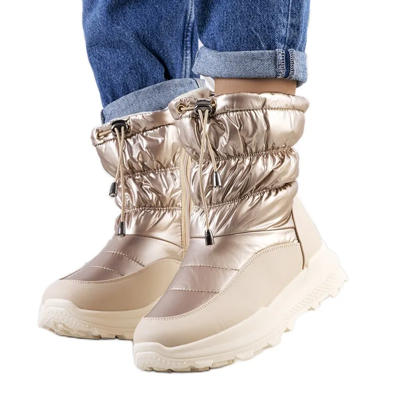 Golden snow boots with Houle cuffs beige